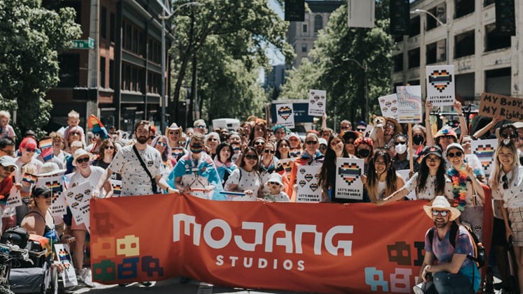 A photo of Mojang Studios participating in a Pride parade.