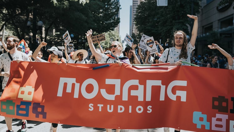 A photo of Mojang Studios participating in a Pride parade.