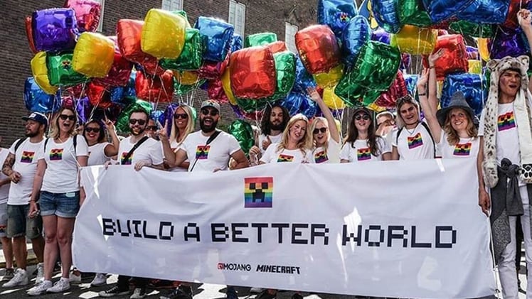 A photo of Mojang Studios participating in a Pride parade.